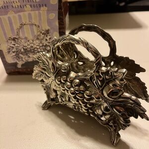Grape napkin holder by studio. Antique finish  silver plated